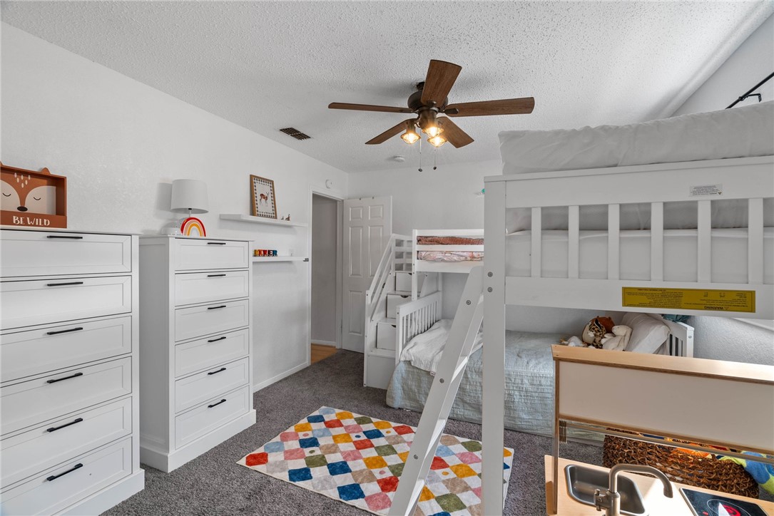 3025 Quail Springs Road, Unit B11 Corpus Christi, TX 78414 - Photo 17 of 20 a bedroom with a bed and furniture