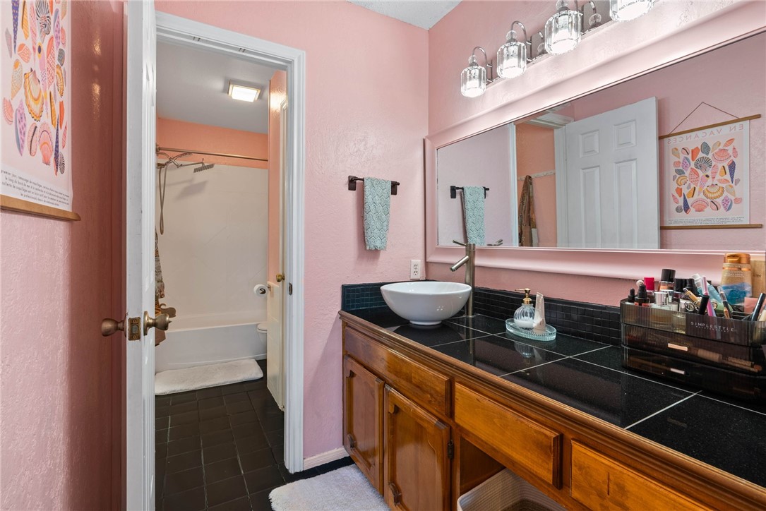 3025 Quail Springs Road, Unit B11 Corpus Christi, TX 78414 - Photo 10 of 20 a bathroom with a sink and a mirror