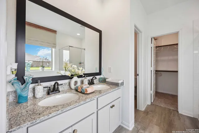 a bathroom with sink and mirror