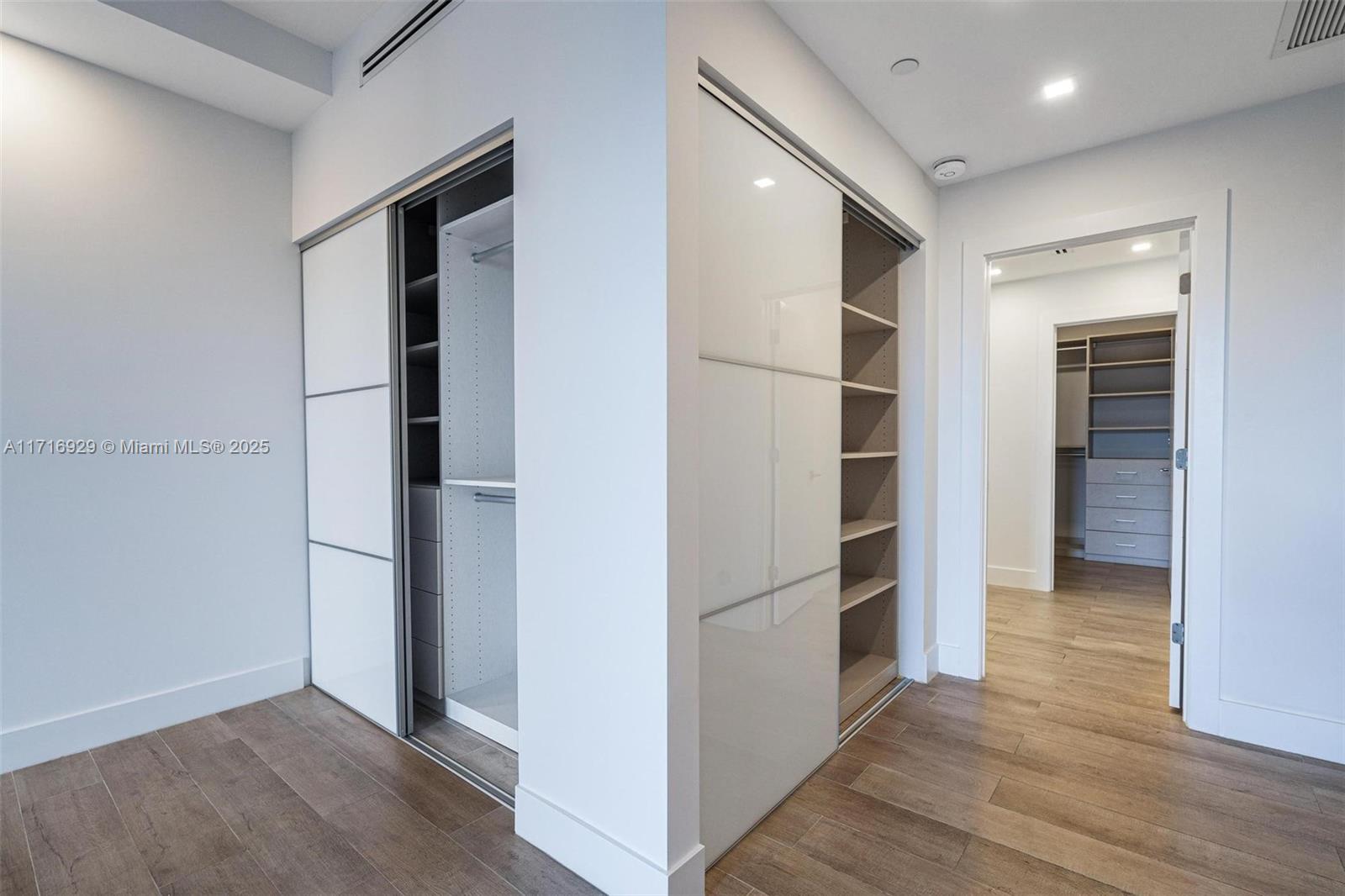 151 Crandon Boulevard, Unit 534 Key Biscayne, FL 33149 - Photo 14 of 49 a view of walk in closet with empty racks