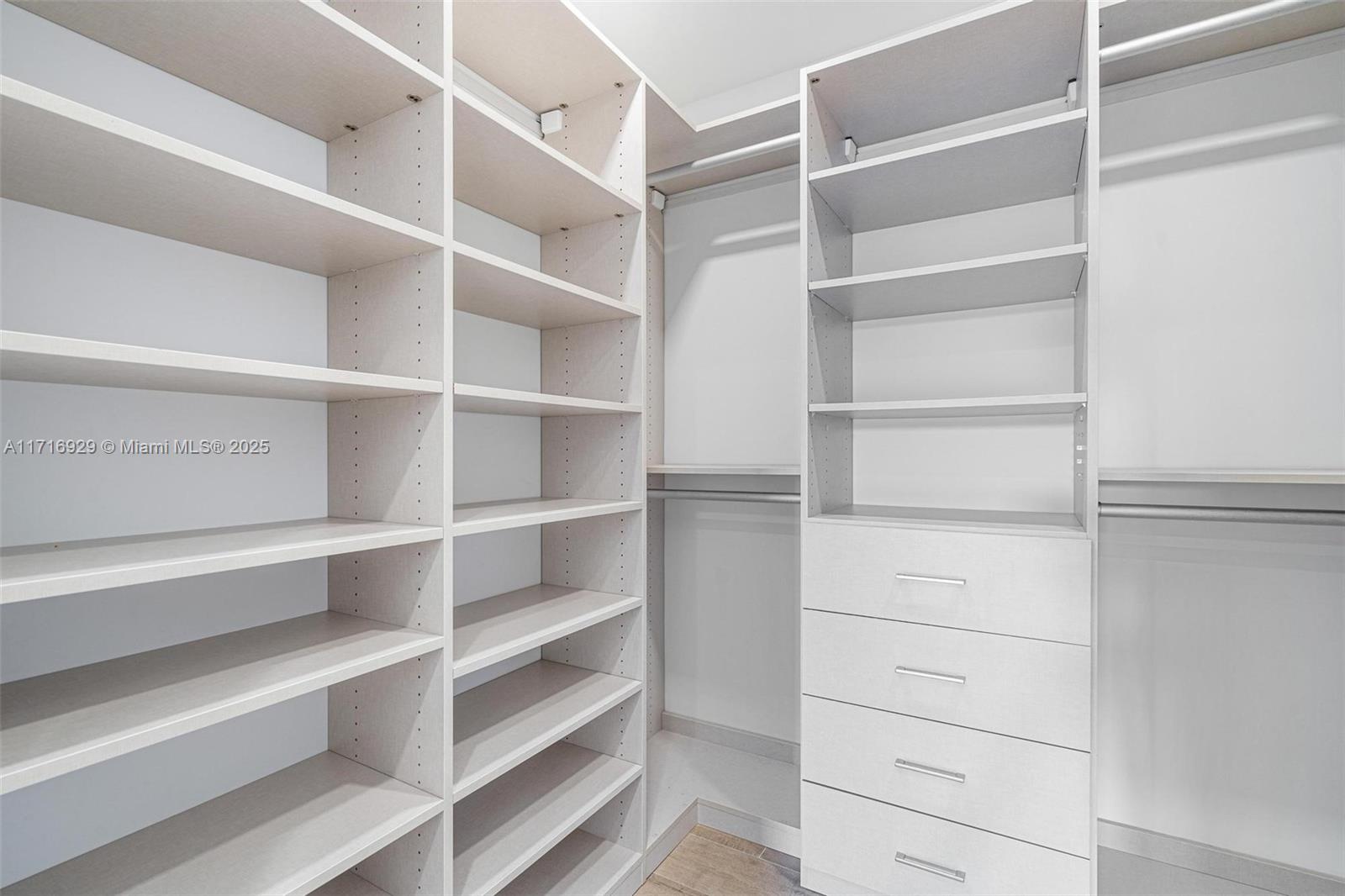 151 Crandon Boulevard, Unit 534 Key Biscayne, FL 33149 - Photo 17 of 49 a view of walk in closet with empty racks