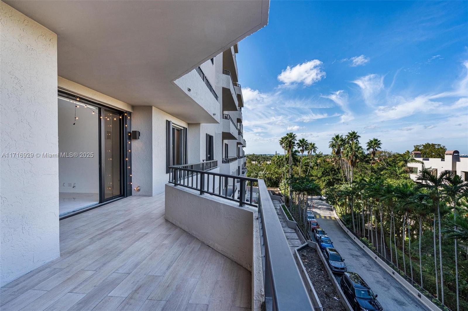 151 Crandon Boulevard, Unit 534 Key Biscayne, FL 33149 - Photo 21 of 49 a view of balcony with wooden floor and fence