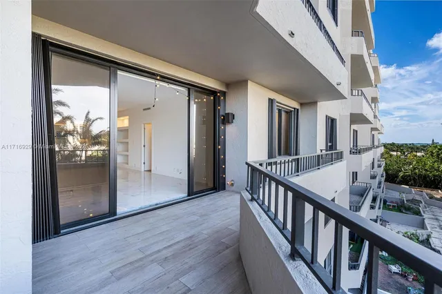 a bathroom with a toilet sink vanity and mirror