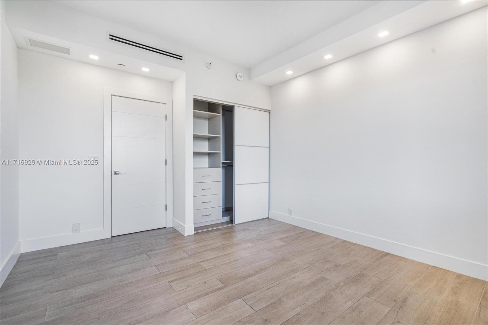 151 Crandon Boulevard, Unit 534 Key Biscayne, FL 33149 - Photo 27 of 49 wooden floor in an empty room