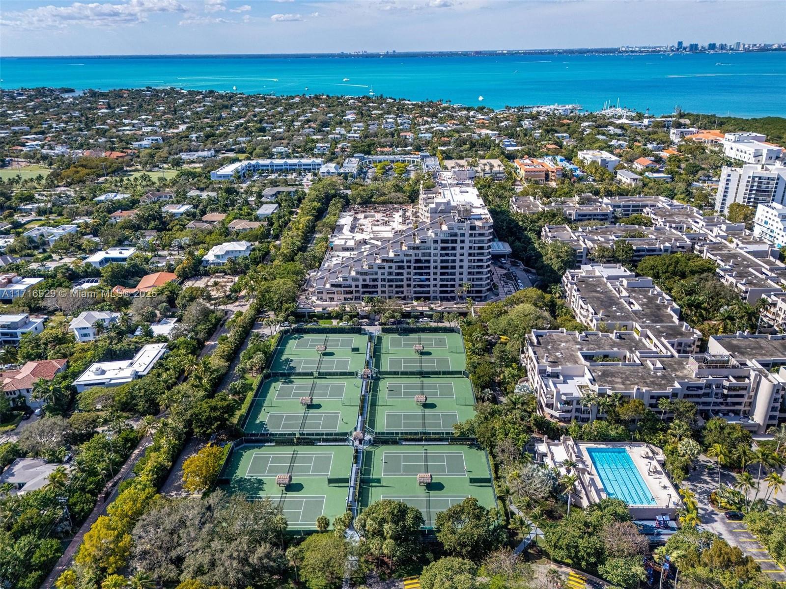 151 Crandon Boulevard, Unit 534 Key Biscayne, FL 33149 - Photo 47 of 49 an aerial view of a city with lots of residential buildings ocean and mountain view in back