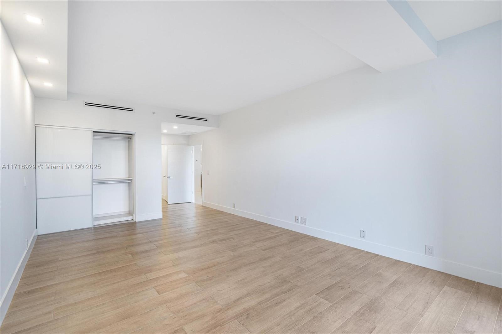 151 Crandon Boulevard, Unit 534 Key Biscayne, FL 33149 - Photo 10 of 49 a view of empty room with wooden floor