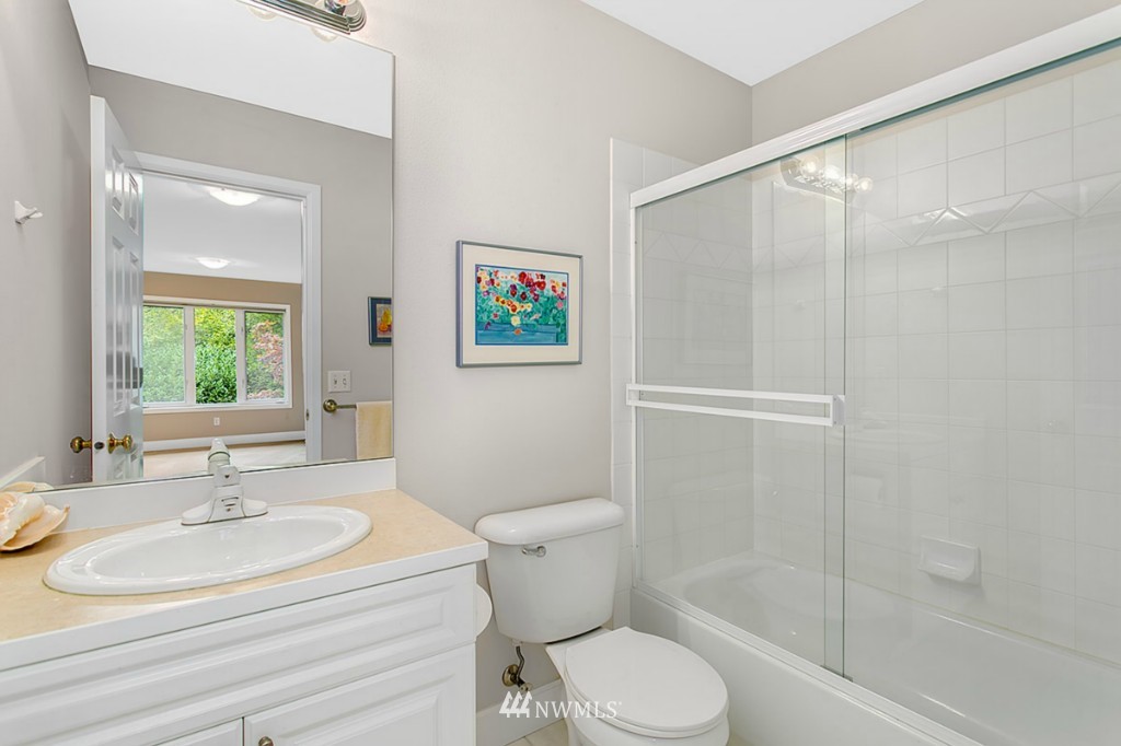 21108 37th Avenue Southeast Bothell, WA 98021 - Photo 22 of 25 a bathroom with a sink toilet and shower