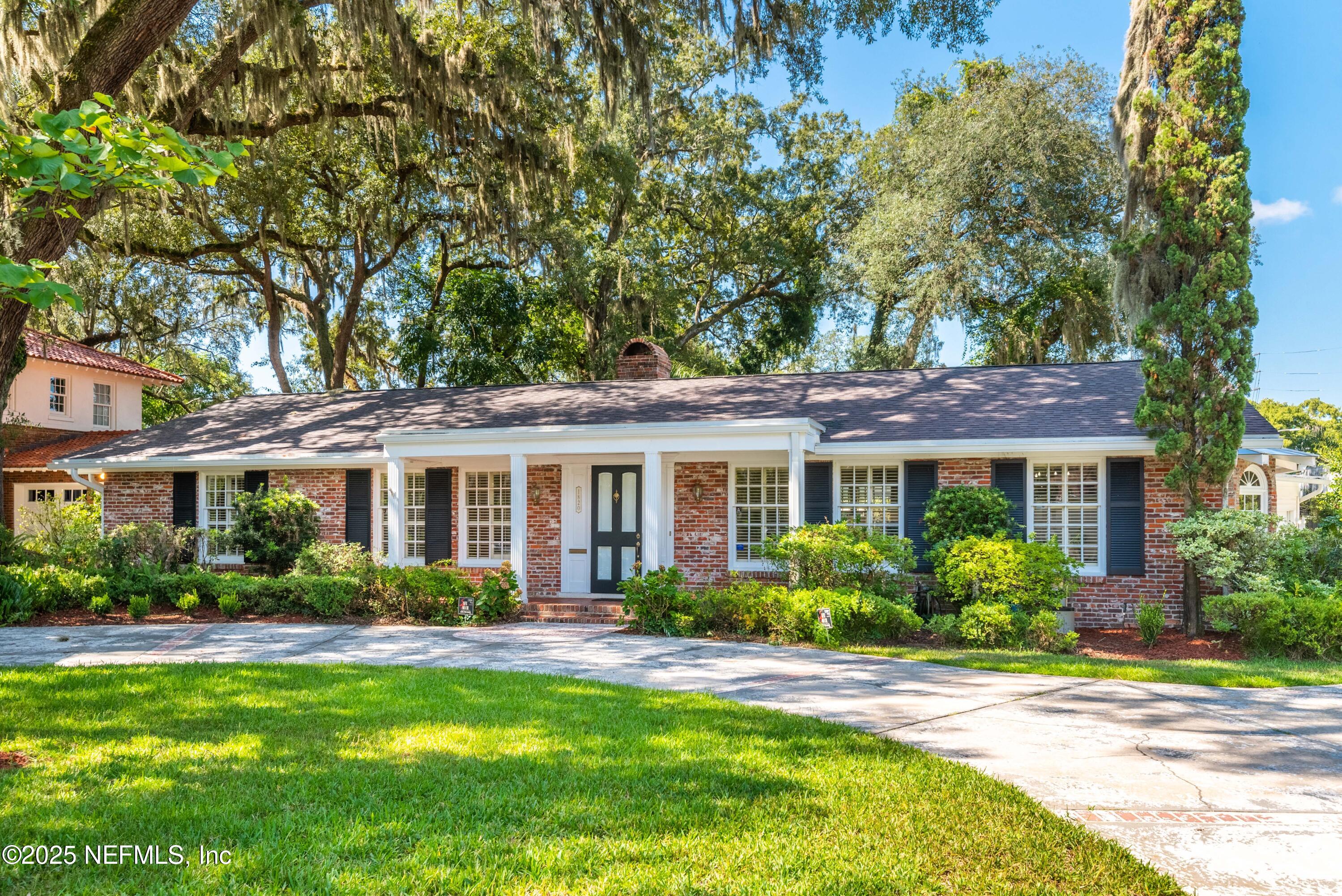 a view of a house with a garden