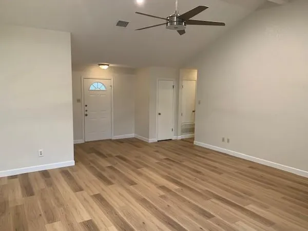 a view of an empty room with a window