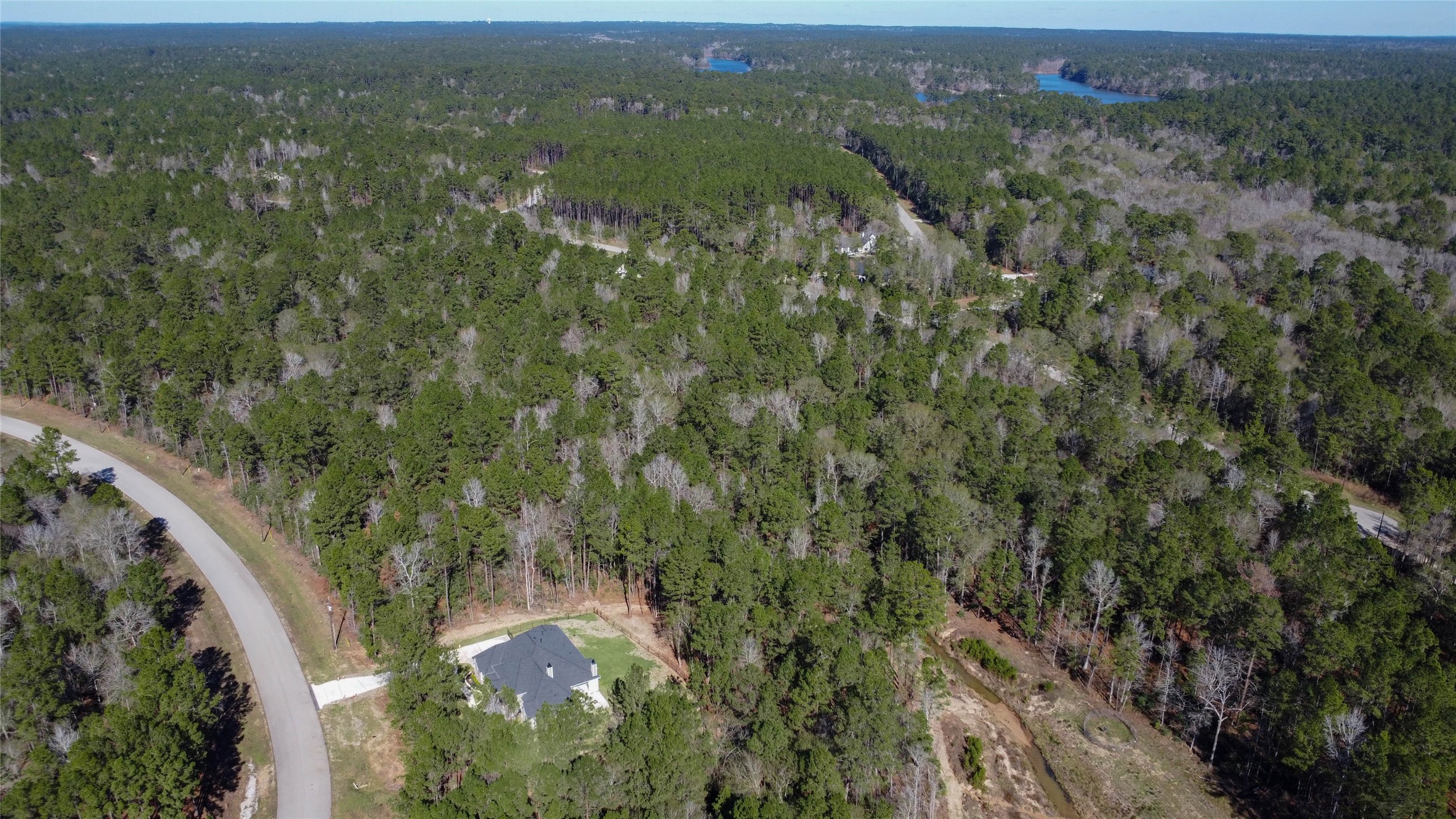 0 Bighorn Road Huntsville, TX 77340 - Photo 14 of 22 an aerial view of residential houses with outdoor space and trees