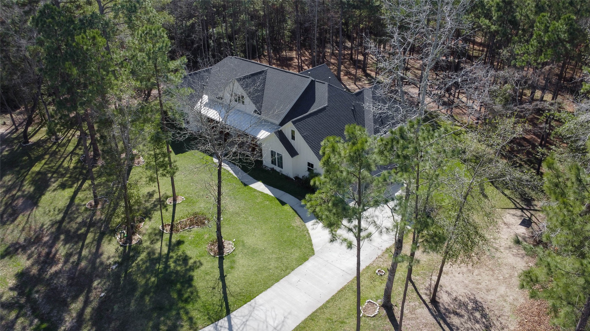 0 Bighorn Road Huntsville, TX 77340 - Photo 18 of 22 a view of a house in a forest