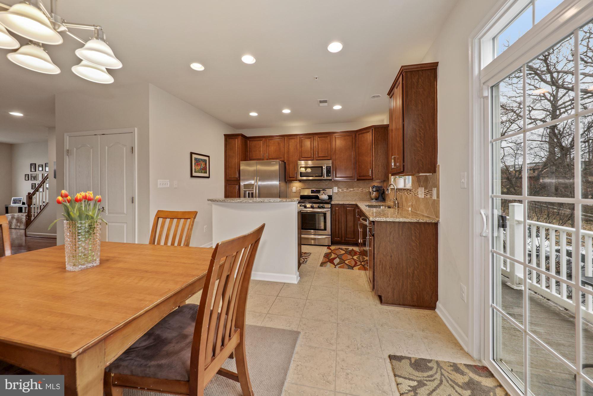 2103 Little Sorrel Way Silver Spring, MD 20902 - Photo 9 of 20 Dining area and kitchen with access to balcony