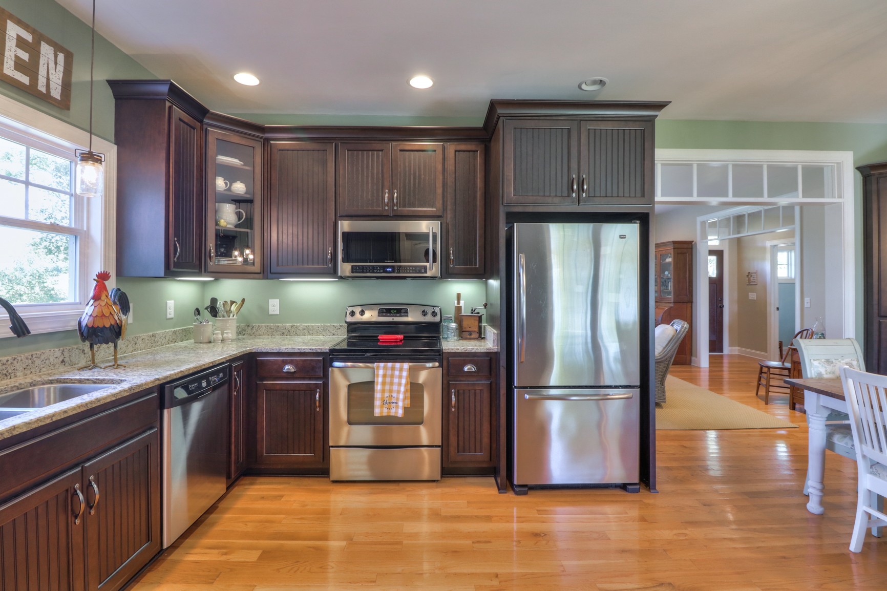 4275 Cairo Bend Road Lebanon, TN 37087 - Photo 11 of 41 a kitchen with stainless steel appliances granite countertop a refrigerator stove a sink and a microwave