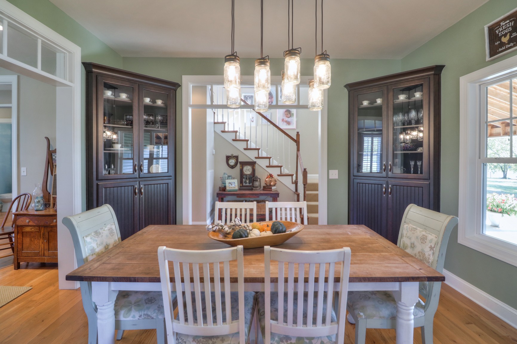 4275 Cairo Bend Road Lebanon, TN 37087 - Photo 13 of 41 a dining room with a table chairs and chandelier
