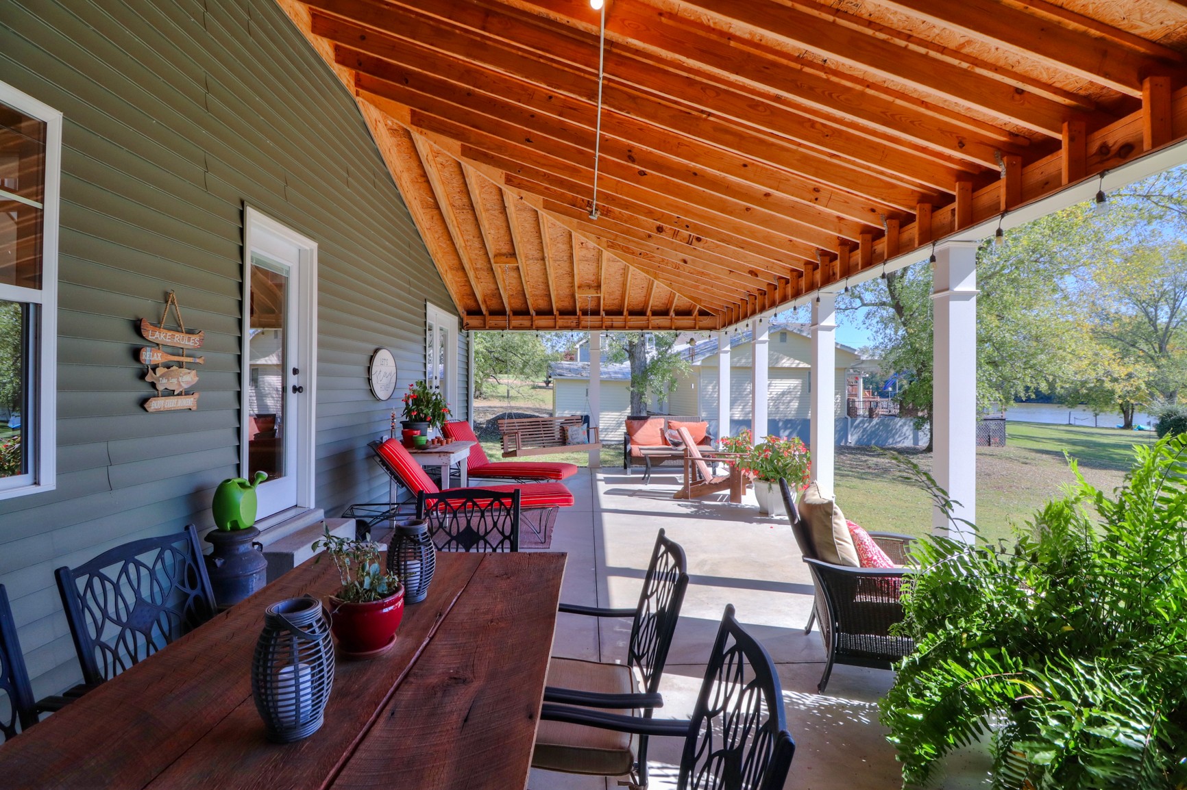 4275 Cairo Bend Road Lebanon, TN 37087 - Photo 16 of 41 a view of a patio with table and chairs potted plants with wooden floor and fence