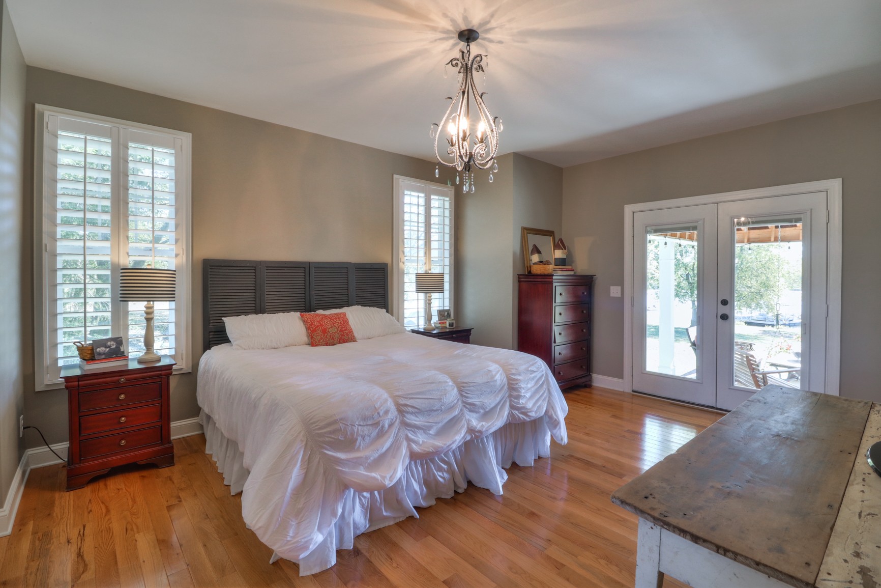 4275 Cairo Bend Road Lebanon, TN 37087 - Photo 18 of 41 a bedroom with a large bed and wooden floor