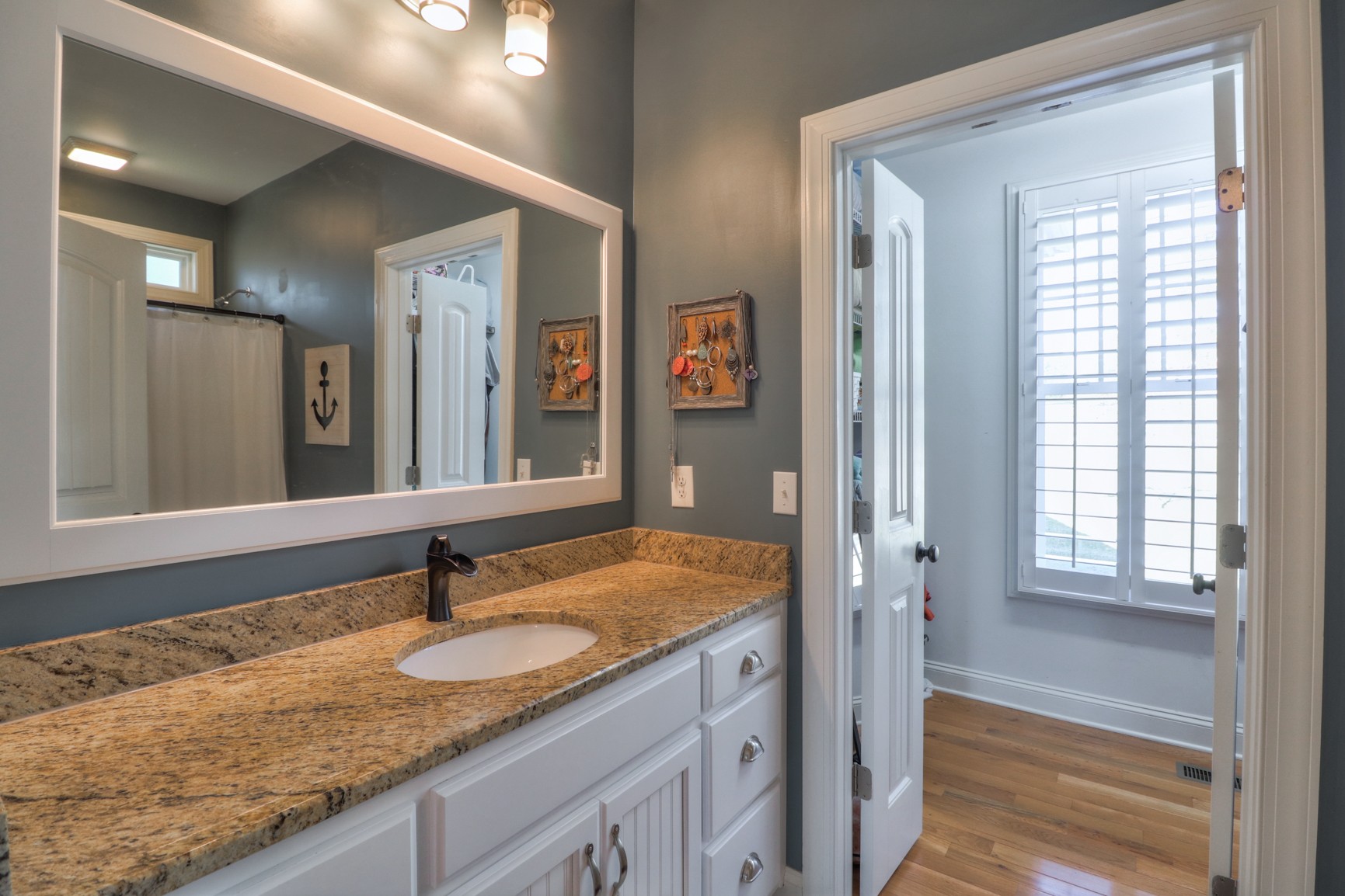 4275 Cairo Bend Road Lebanon, TN 37087 - Photo 19 of 41 a bathroom with a granite countertop sink and a mirror