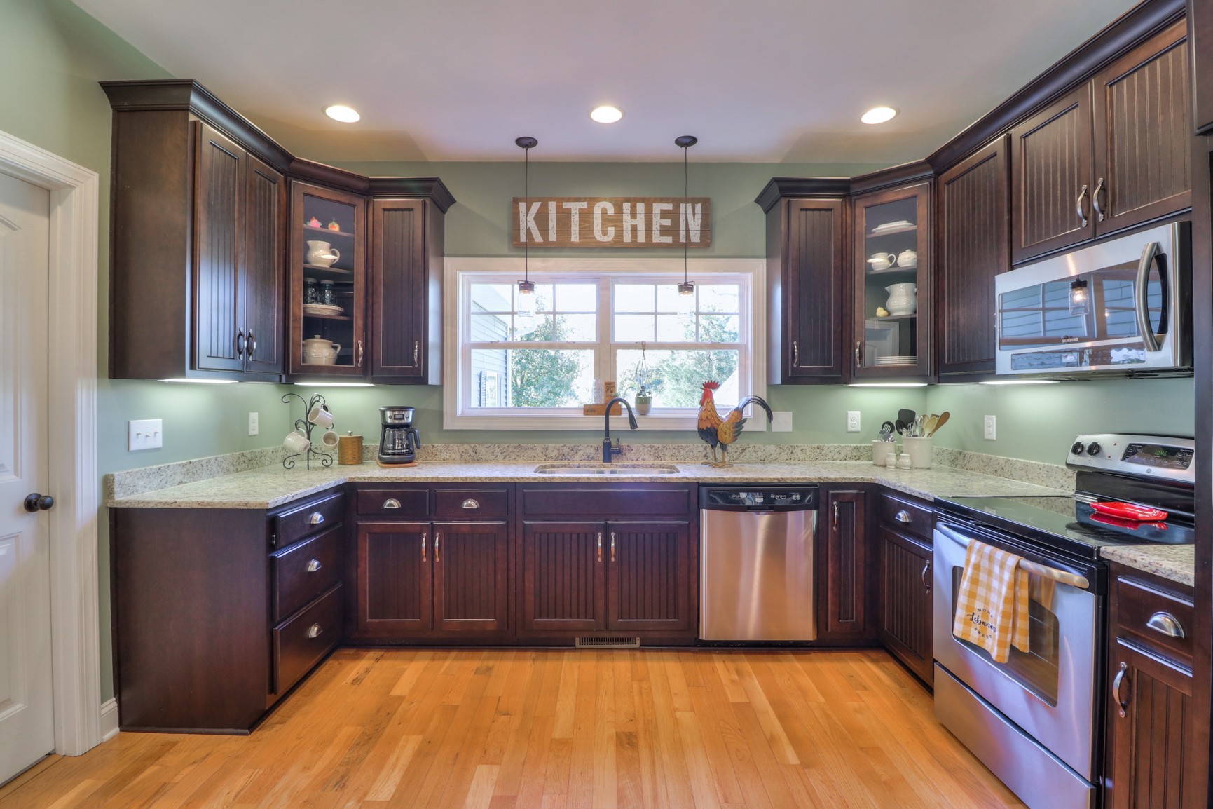 4275 Cairo Bend Road Lebanon, TN 37087 - Photo 10 of 41 a kitchen with stainless steel appliances granite countertop wooden cabinets a sink and dishwasher