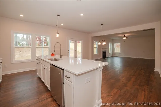 a bathroom with a sink a large mirror and a shower