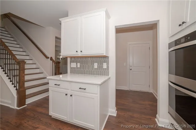 a view of a kitchen with washer and dryer