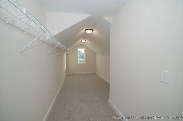 a view of a hallway with windows