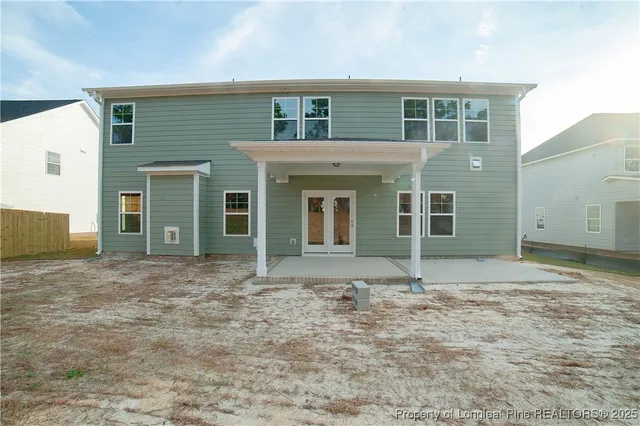 a view of house with backyard space