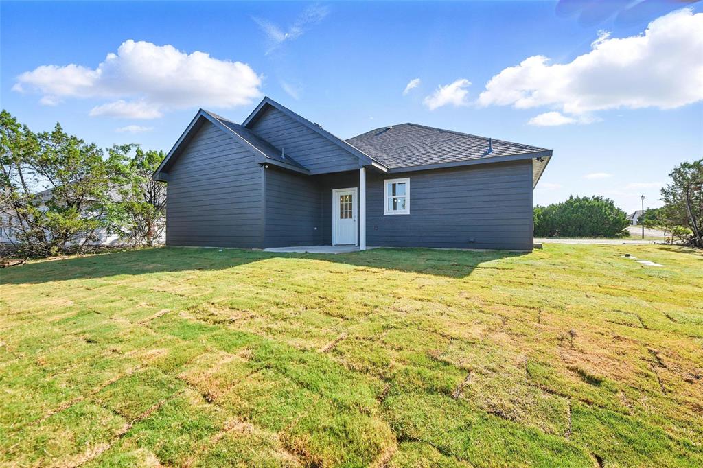 112 Cedar Shadow Lane Whitney, TX 76692 - Photo 26 of 28 a view of a backyard of the house
