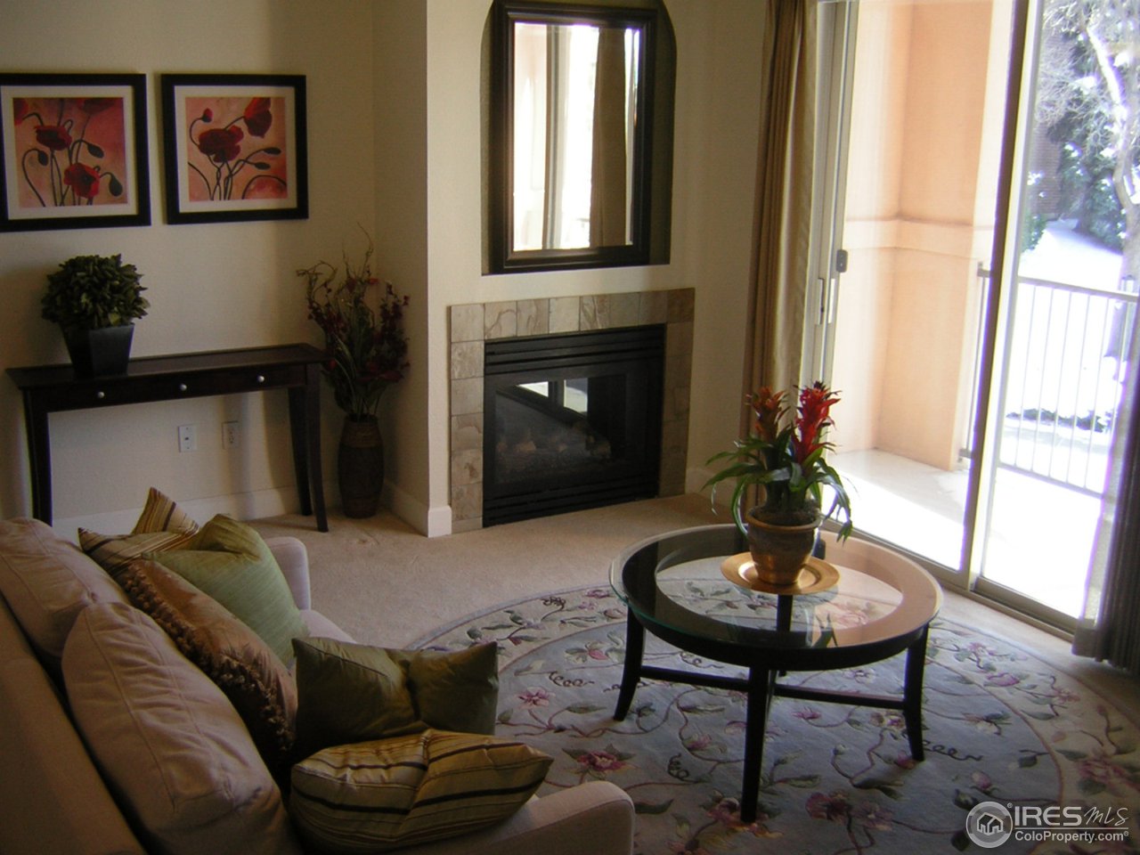 4500 Baseline Road, Unit 2207 Boulder, CO 80303 - Photo 11 of 16 a living room with furniture and a fireplace