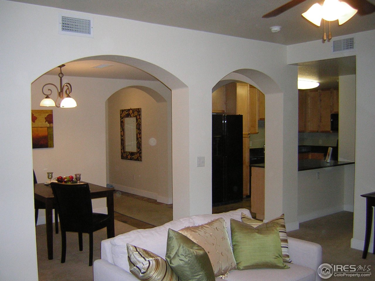4500 Baseline Road, Unit 2207 Boulder, CO 80303 - Photo 6 of 16 a living room with furniture and a chandelier