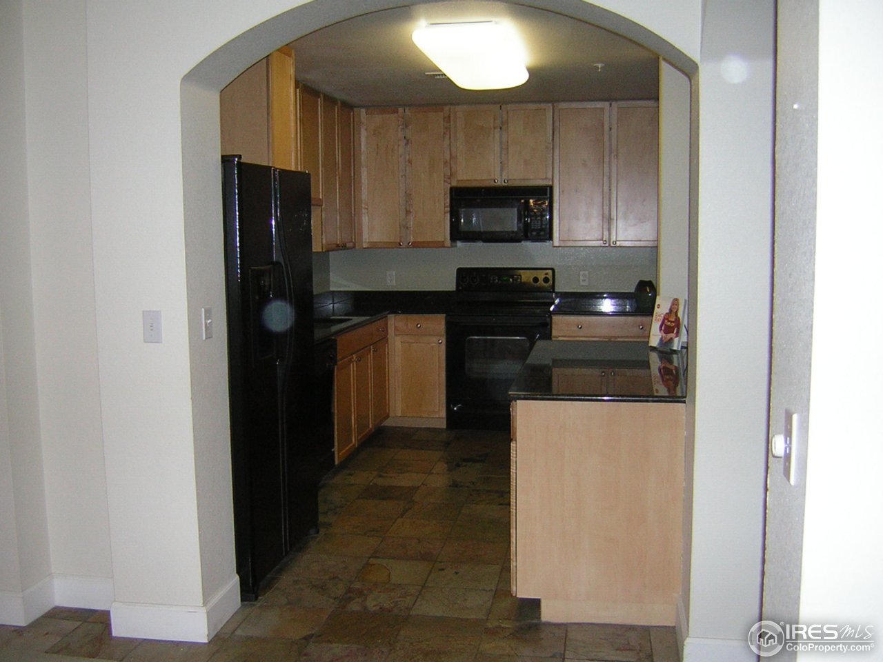 4500 Baseline Road, Unit 2207 Boulder, CO 80303 - Photo 8 of 16 a kitchen with a refrigerator and a stove