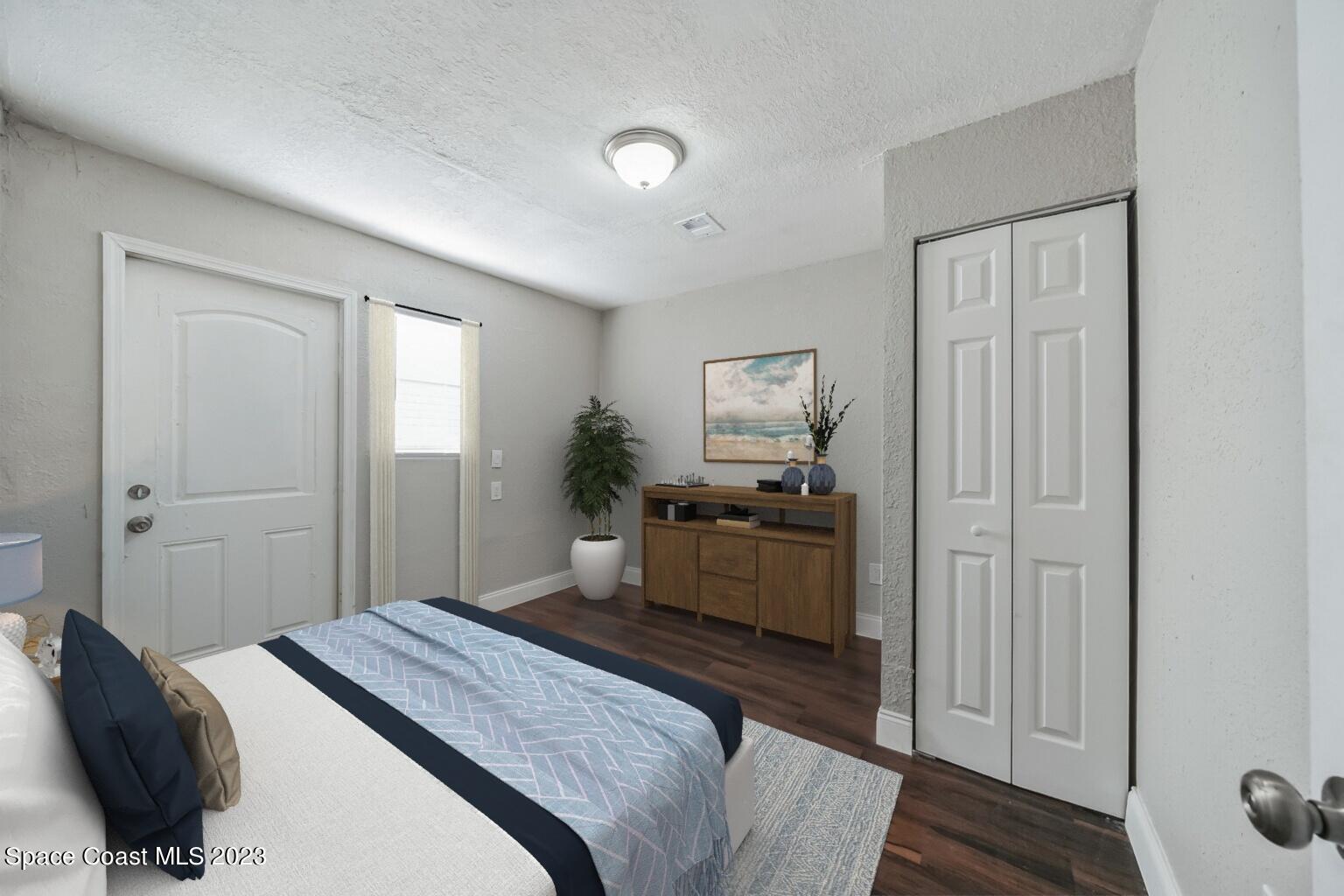 2263 Monroe Street Palm Bay, FL 32905 - Photo 11 of 13 a bedroom with a bed and a dresser