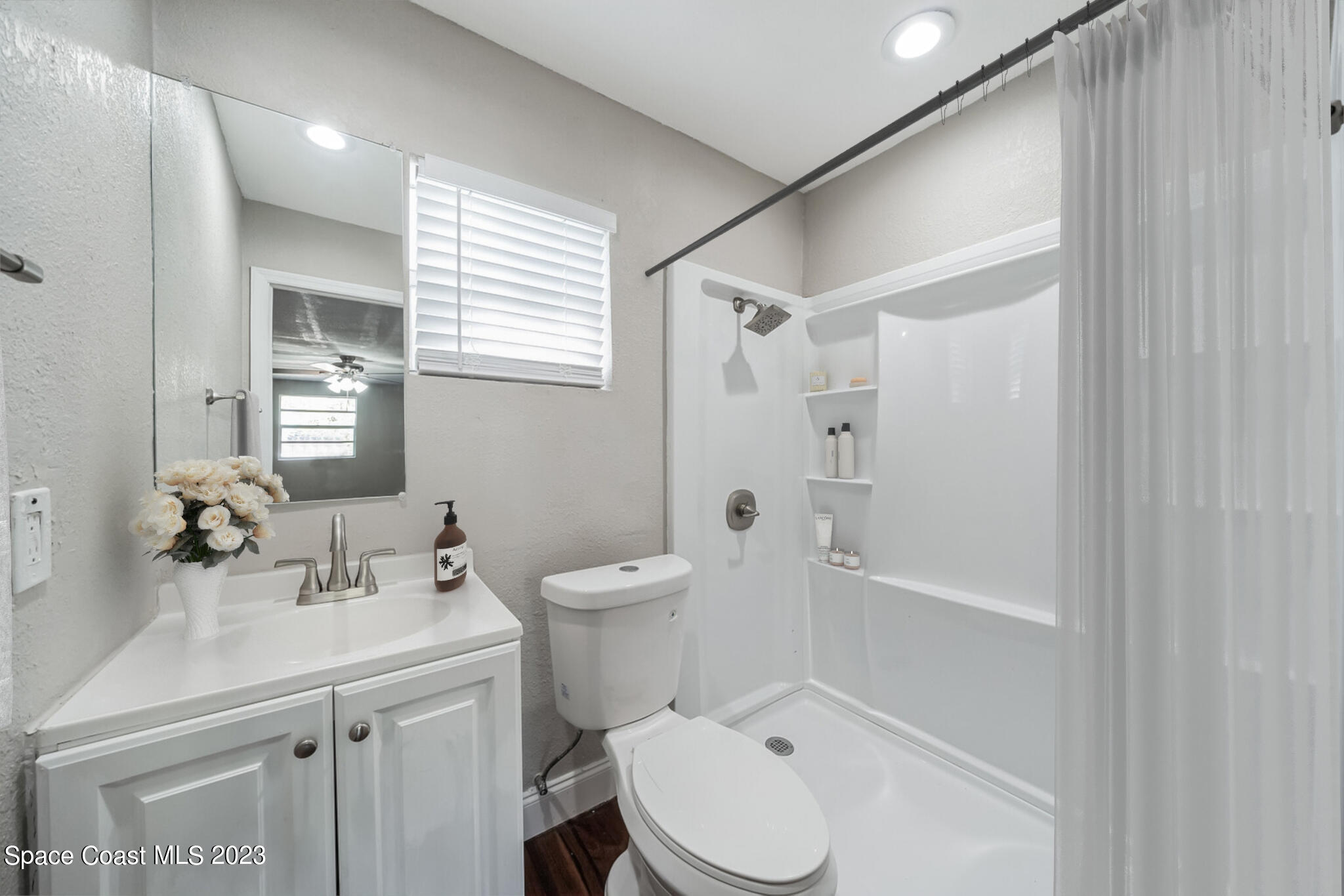 2263 Monroe Street Palm Bay, FL 32905 - Photo 12 of 13 a bathroom with a sink toilet and shower
