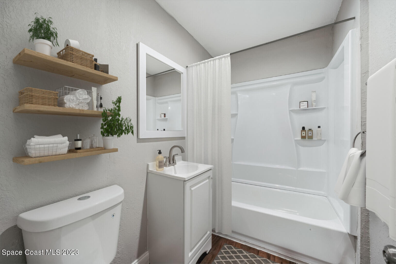 2263 Monroe Street Palm Bay, FL 32905 - Photo 13 of 13 a bathroom with a tub toilet and sink