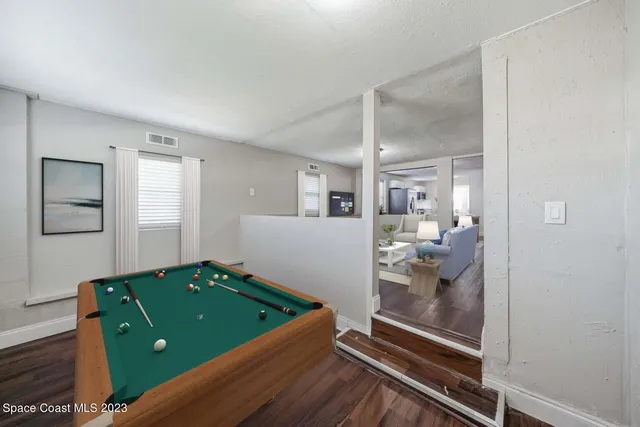a kitchen with white cabinets and appliances