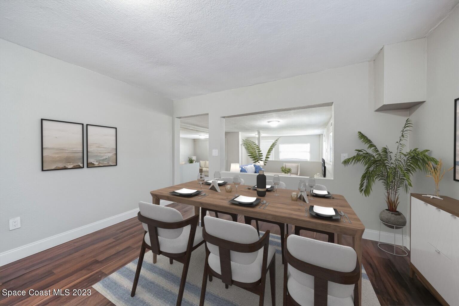 2263 Monroe Street Palm Bay, FL 32905 - Photo 5 of 13 a dining room with furniture and wooden floor