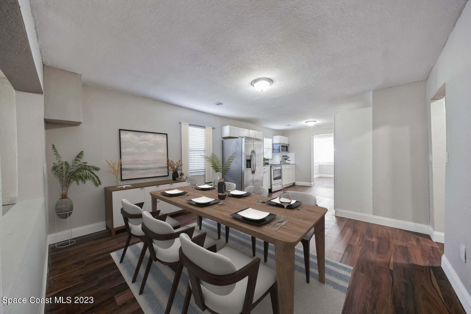 2263 Monroe Street Palm Bay, FL 32905 - Photo 6 of 13 a view of a dining room with furniture and wooden floor