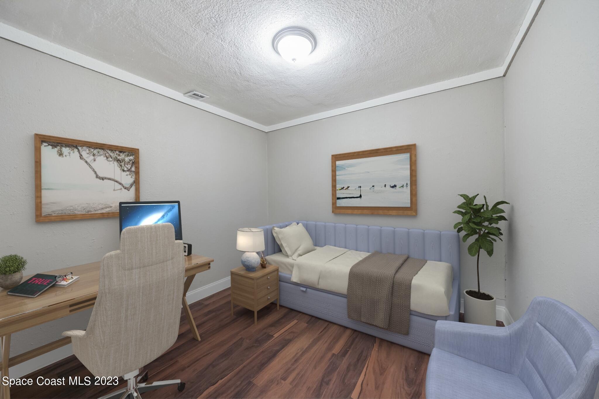 2263 Monroe Street Palm Bay, FL 32905 - Photo 10 of 13 a bedroom with a bed and a potted plant