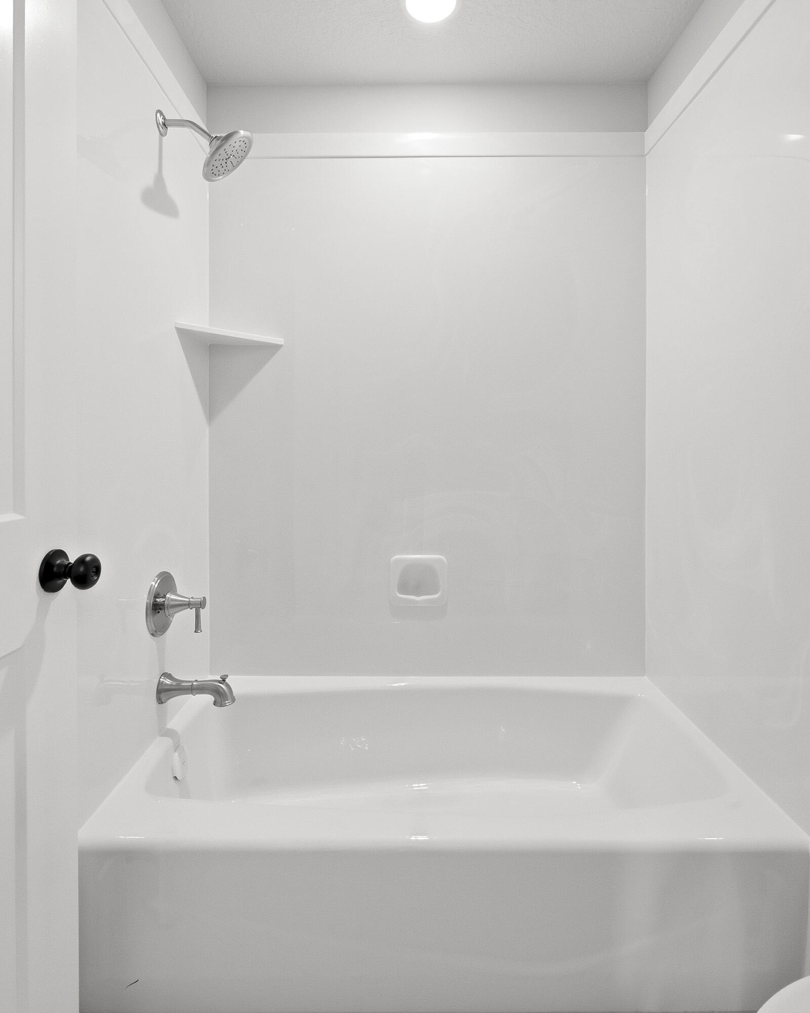 1852 South Hidden Canyon Road Cedar City, UT 84720 - Photo 55 of 79 This bathroom is split into two functional spaces—one with the vanity and sinks, and the other with the toilet and tub/shower combo.
