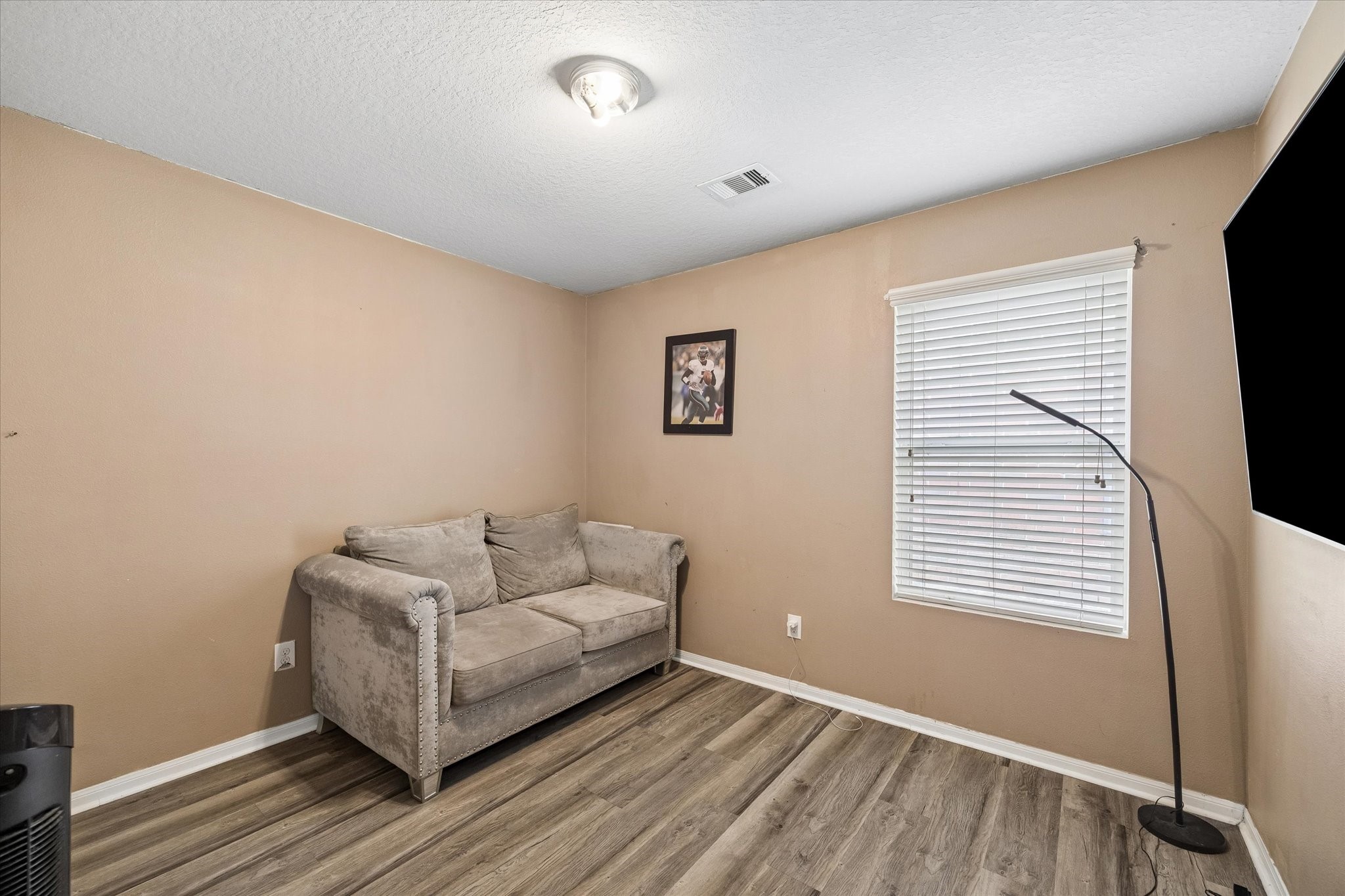 4830 Conifer Ridge Way Humble, TX 77346 - Photo 13 of 16 a living room with furniture and a flat screen tv
