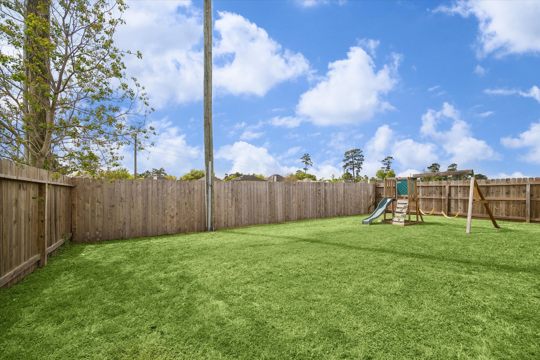 4830 Conifer Ridge Way Humble, TX 77346 - Photo 15 of 16 a view of a backyard