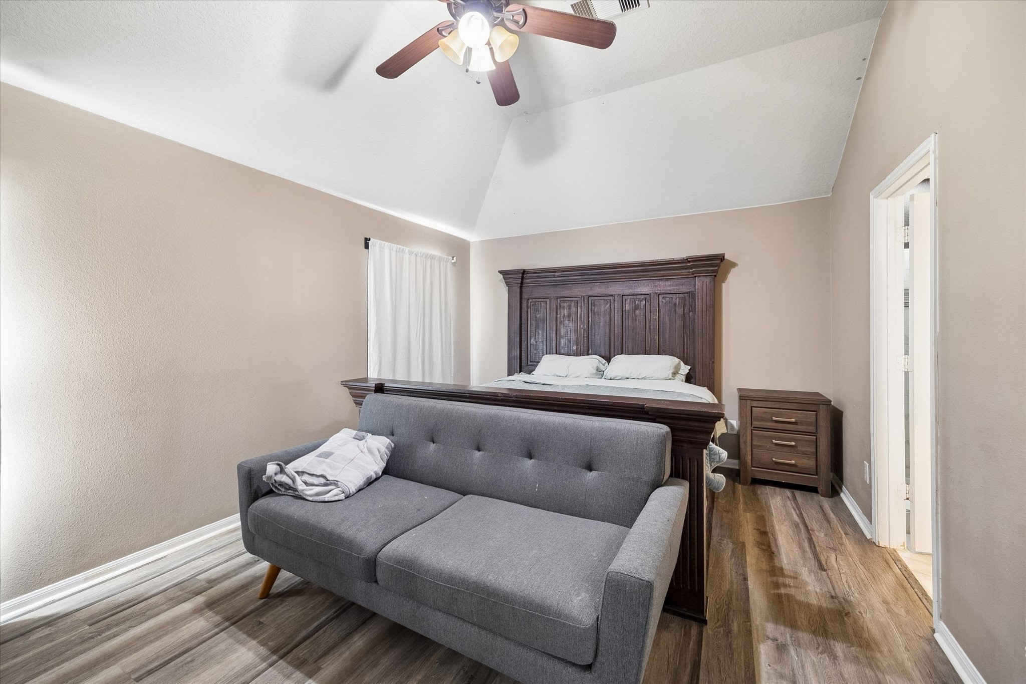 4830 Conifer Ridge Way Humble, TX 77346 - Photo 4 of 16 a bedroom with a bed and wooden floor