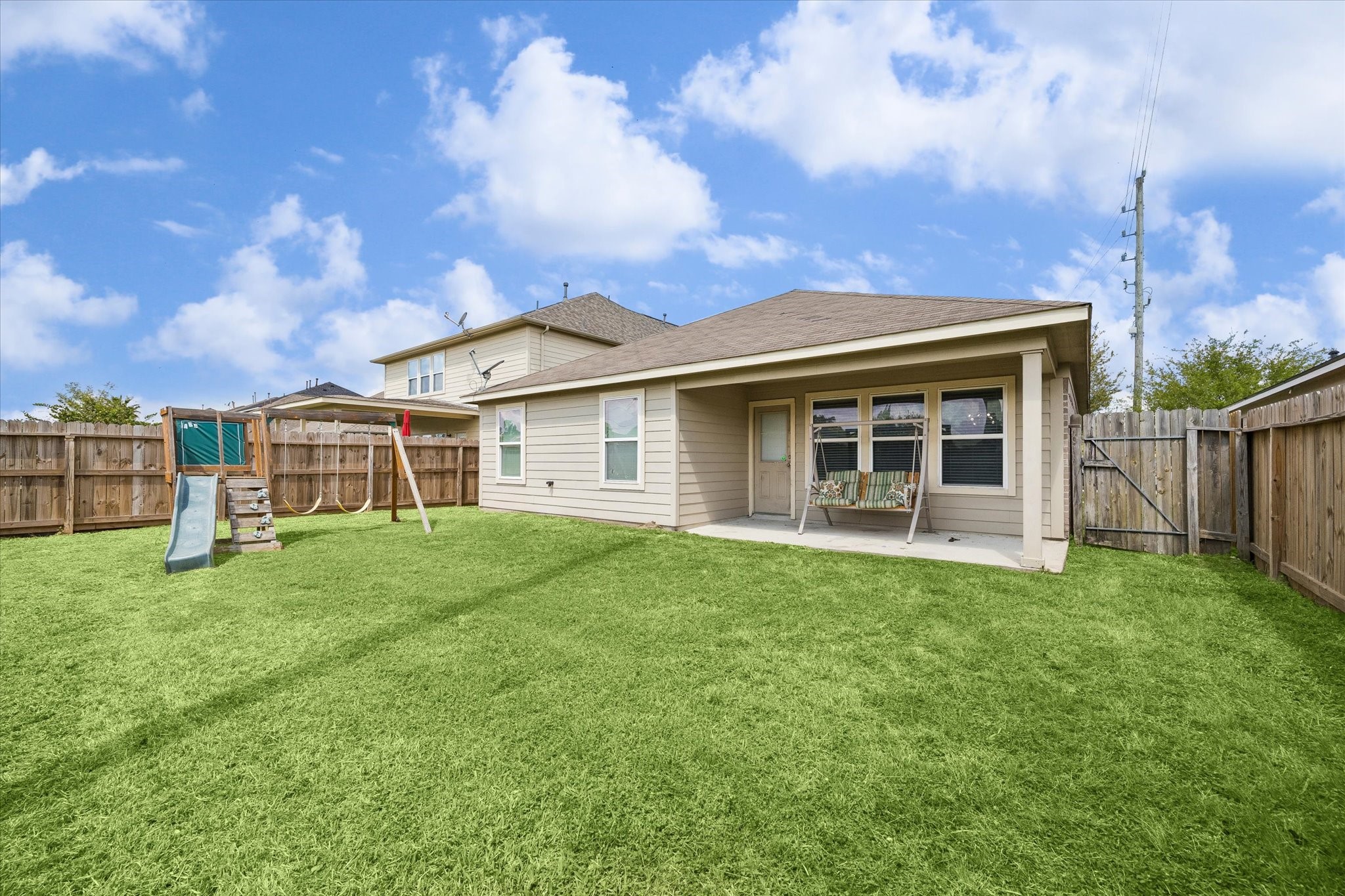 4830 Conifer Ridge Way Humble, TX 77346 - Photo 5 of 16 a view of a yard in front of a house with a large tree