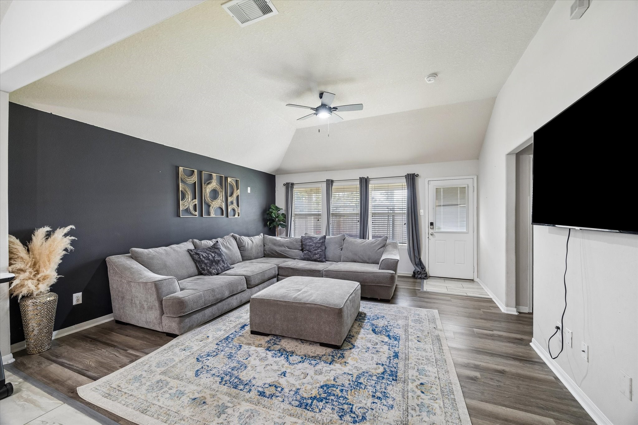 4830 Conifer Ridge Way Humble, TX 77346 - Photo 6 of 16 a living room with furniture and a flat screen tv