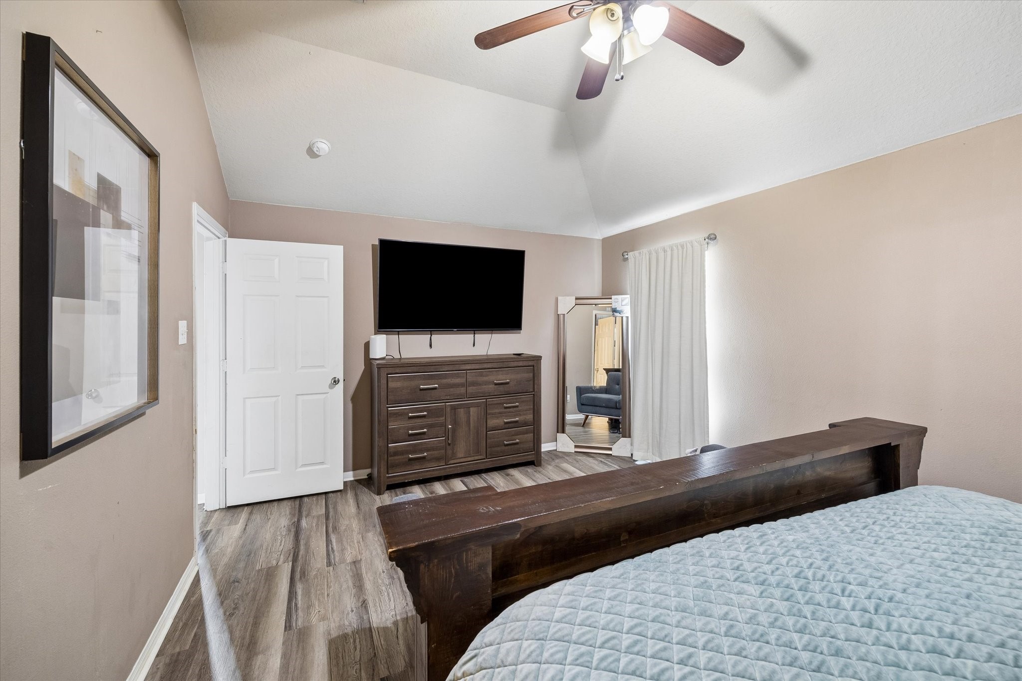 4830 Conifer Ridge Way Humble, TX 77346 - Photo 7 of 16 a bedroom with a bed and a flat screen tv