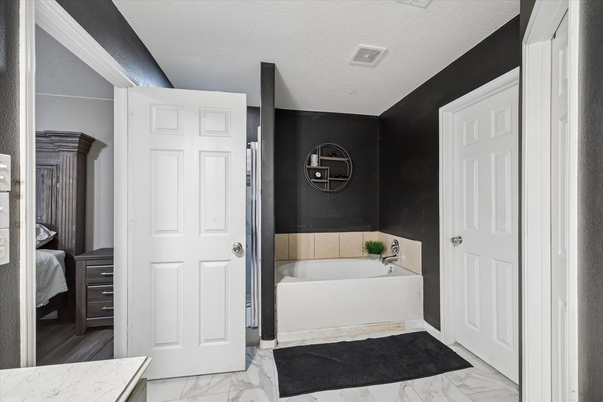 4830 Conifer Ridge Way Humble, TX 77346 - Photo 8 of 16 a walk in closet with wooden floor