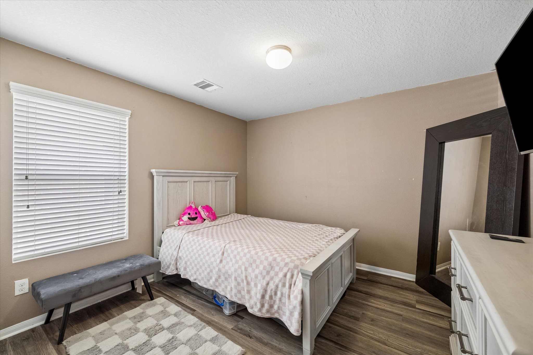 4830 Conifer Ridge Way Humble, TX 77346 - Photo 9 of 16 a bedroom with a bed and a window