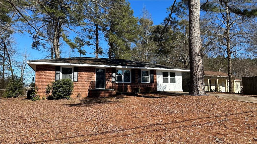 570 Boggs Road Mableton, GA 30126 - Photo 1 of 1 a front view of a house with basket ball court
