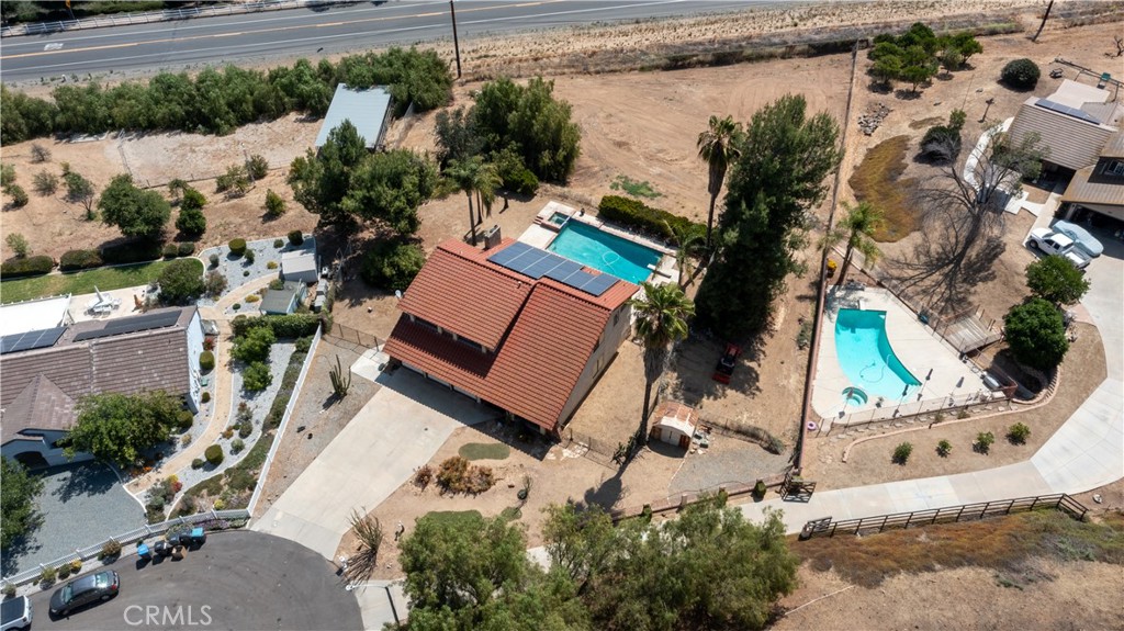 17656 Mockingbird Hill Circle Riverside, CA 92504 - Photo 40 of 49 an aerial view of a house with a garden and trees