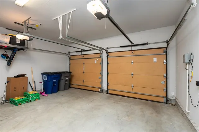 a large kitchen with kitchen island a sink stainless steel appliances and cabinets