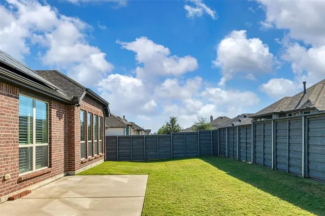 a balcony with furniture and a view of the back
